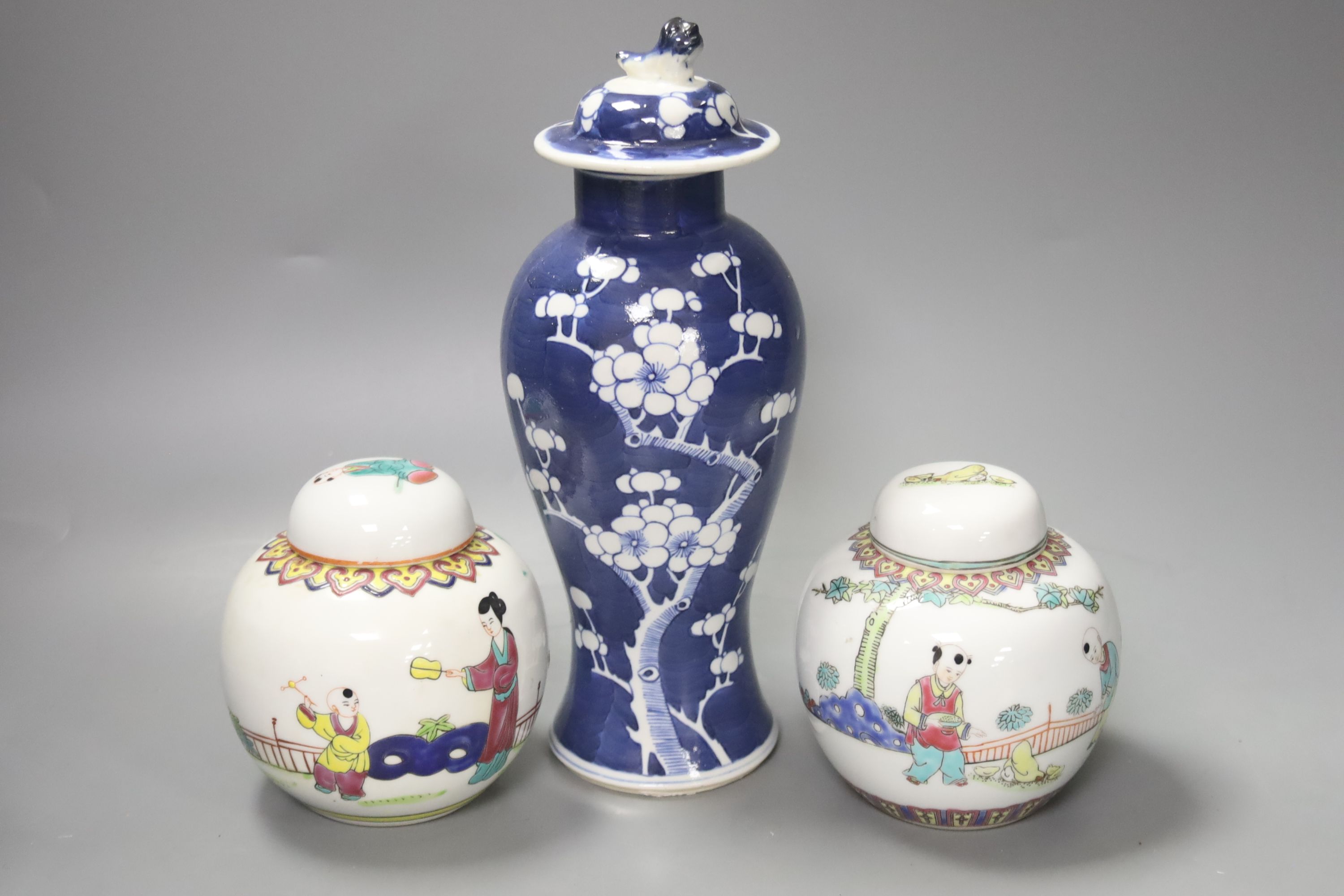 Two pairs of Chinese jars, one pair with covers, two other jars and a blue and white vase and cover, height 26cm